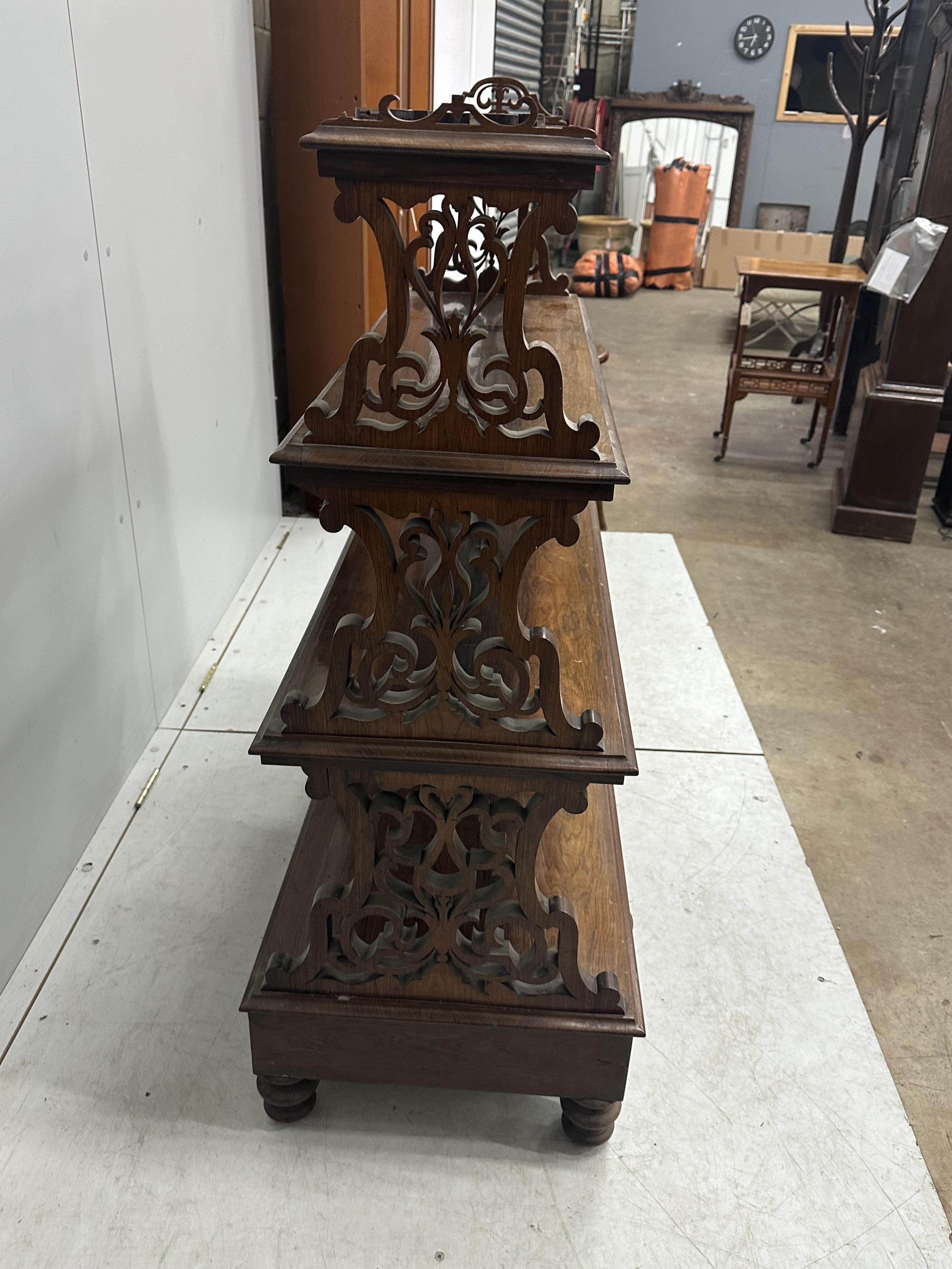 A Victorian rosewood graduated open bookcase, width 91cm, depth 45cm, height 113cm. Condition - poor to fair